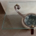 Tavolino basso piano in Vetro basamento in pietra e metallo 2