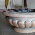 Tavolino basso piano in Vetro basamento in pietra e metallo